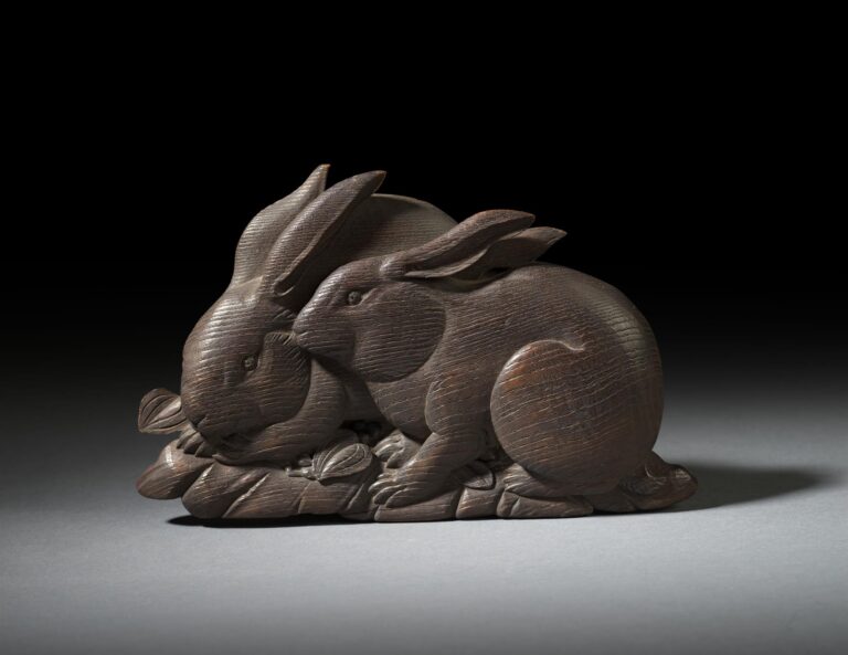 Carved Pair of Rabbits Amongst Foliage SOLD