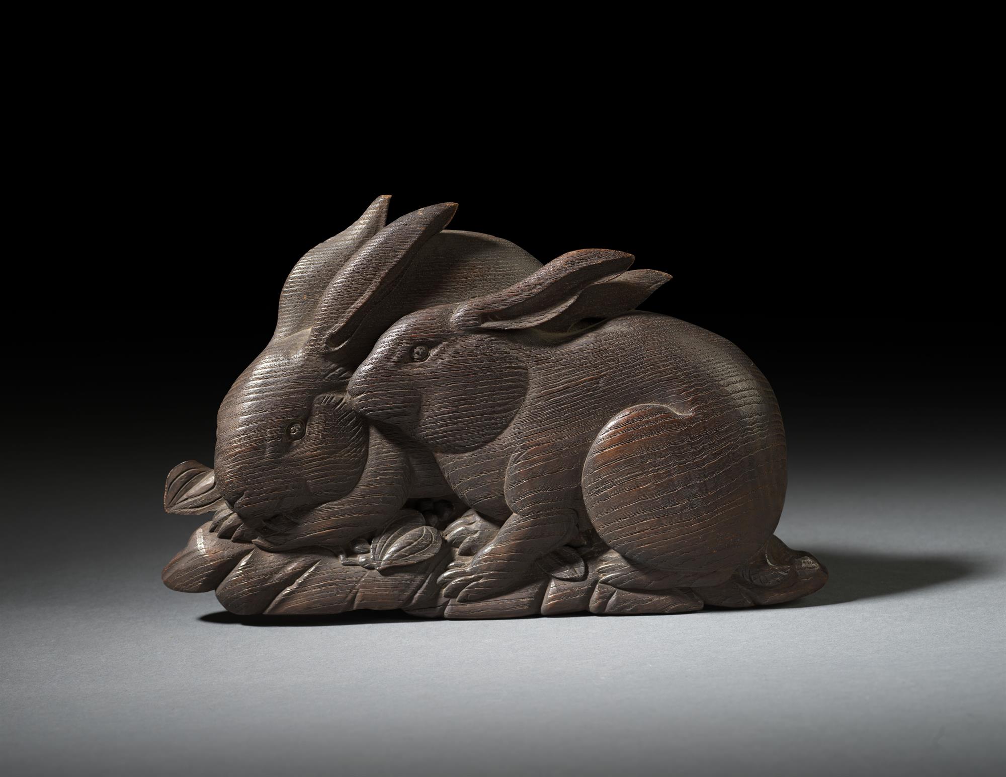 Carved Pair of Rabbits Amongst Foliage SOLD