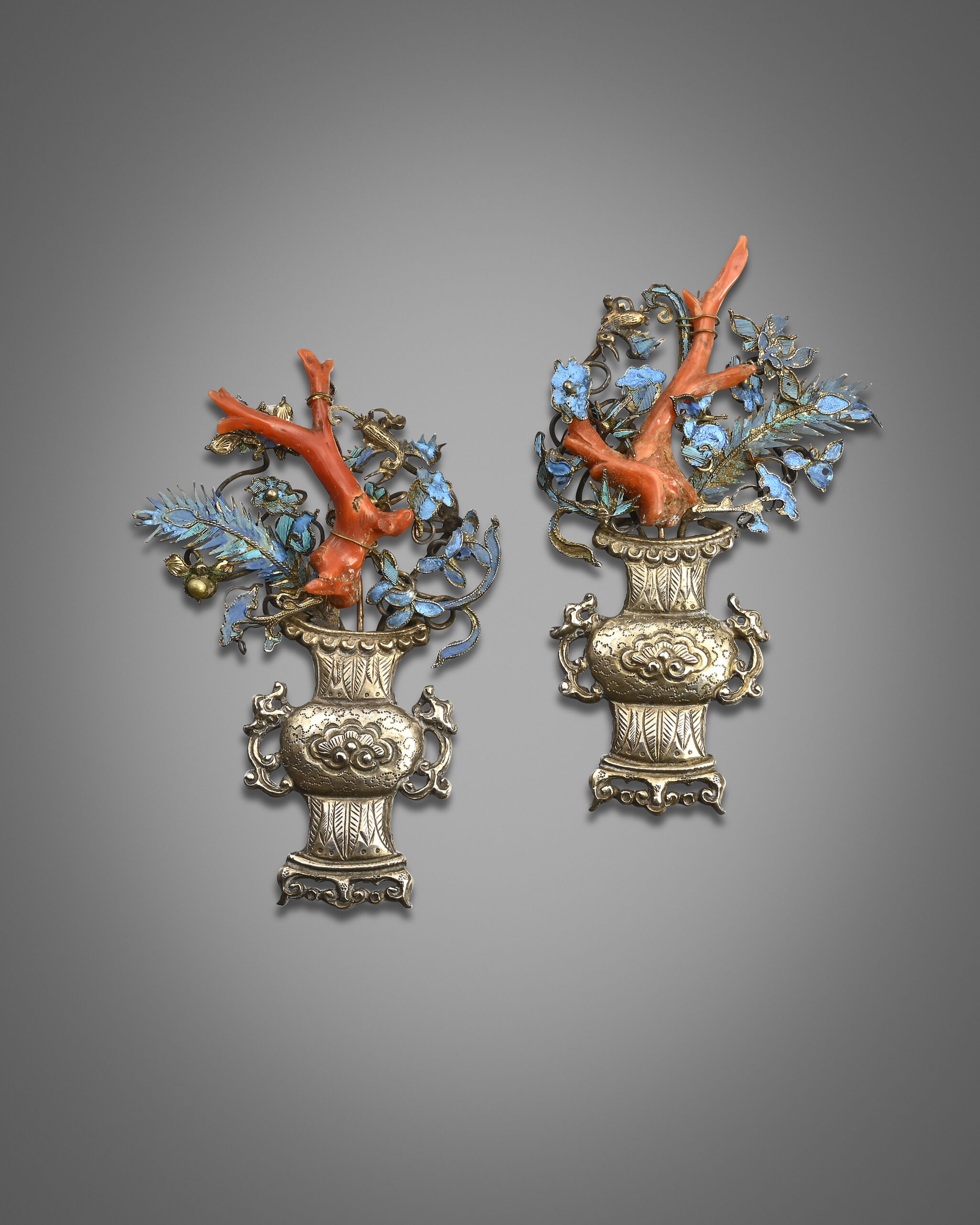 A pair of Chinese silver and kingfisher feather appliques